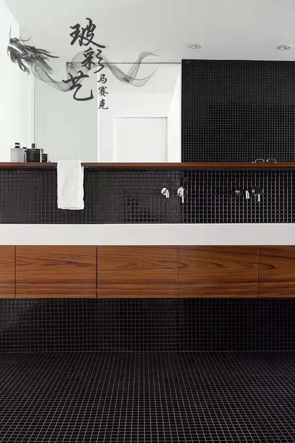 Ceramic mosaic wall tiles in black square grid pattern behind vanity and counter.