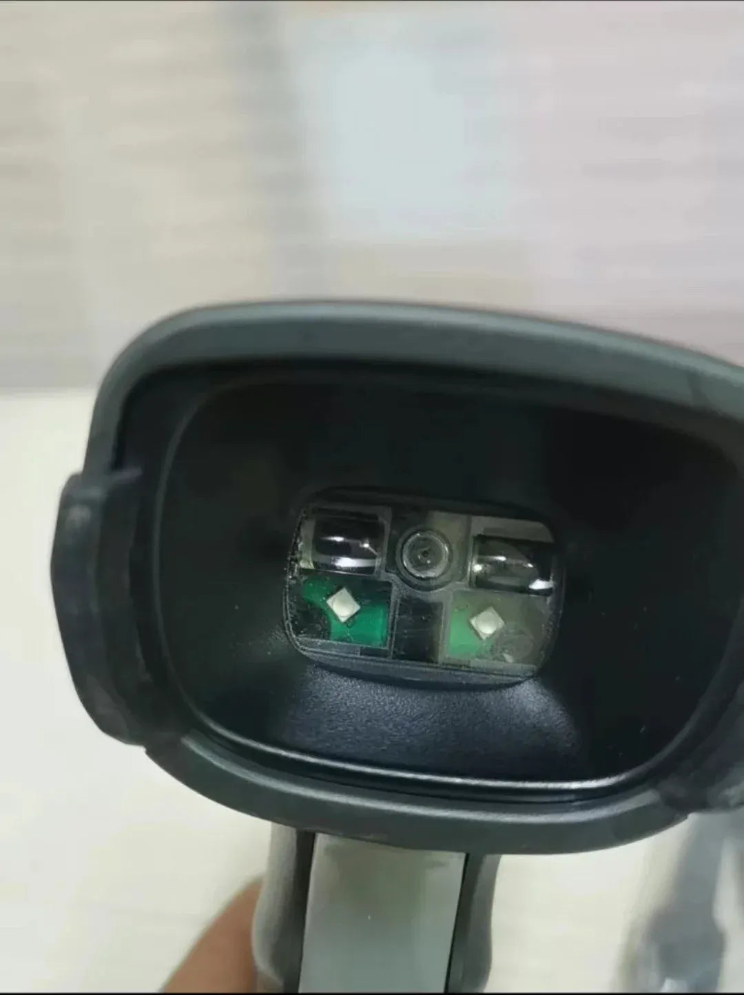 2D wired handheld barcode scanner open base showing internal green circuit boards