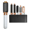 6-in-1 professional hair dryer brush set in white and gold with curling iron, straightener, and styling attachments.