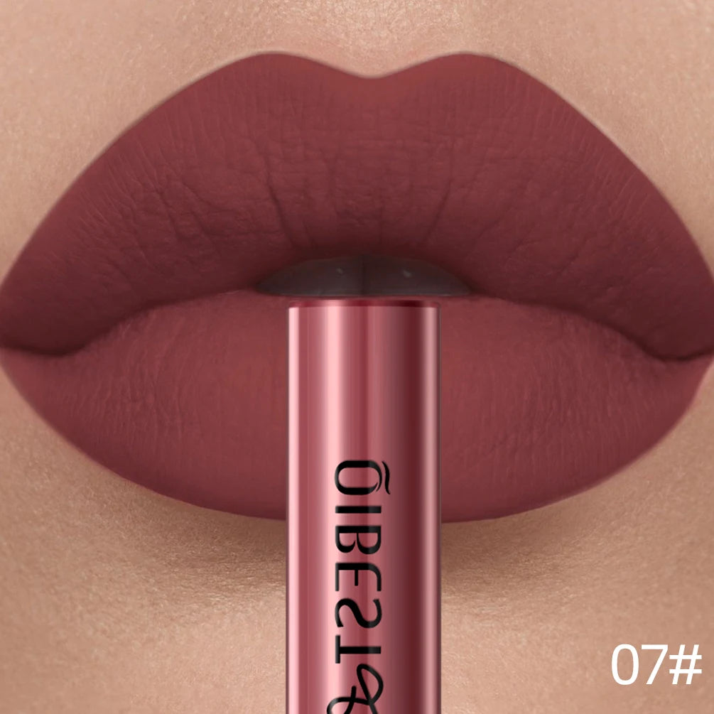 Long-lasting matte liquid lipstick in shade 07, featuring a velvety, waterproof nude-red finish on lips.