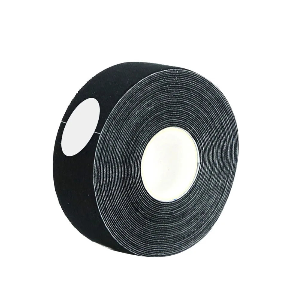 A roll of black anti-wrinkle face lift tape with a white cardboard core, set against a plain white background.