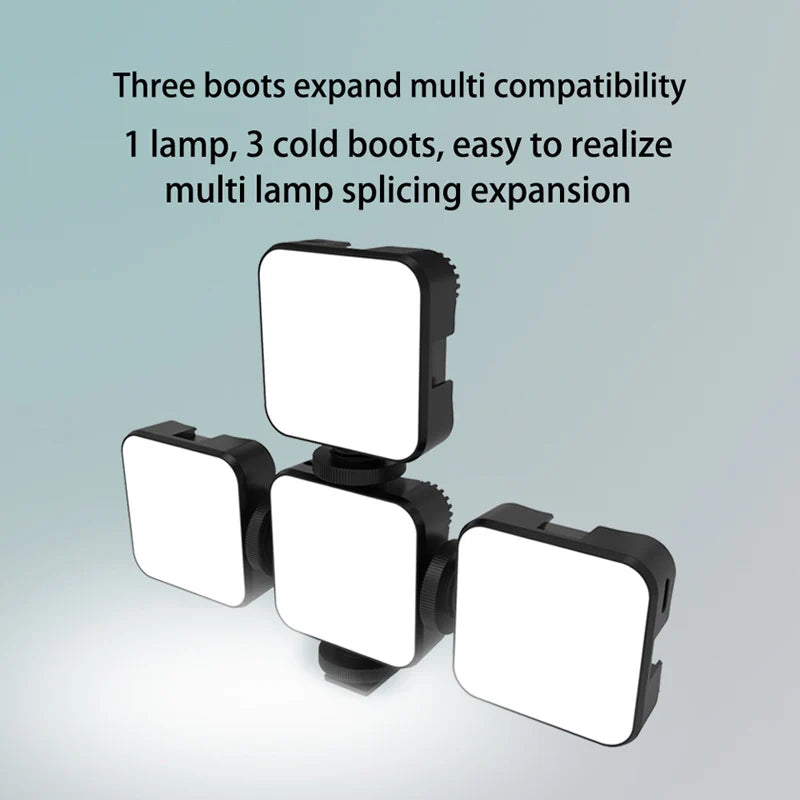 Three square black LED video lights connected together to form an expandable, multi-light studio setup.