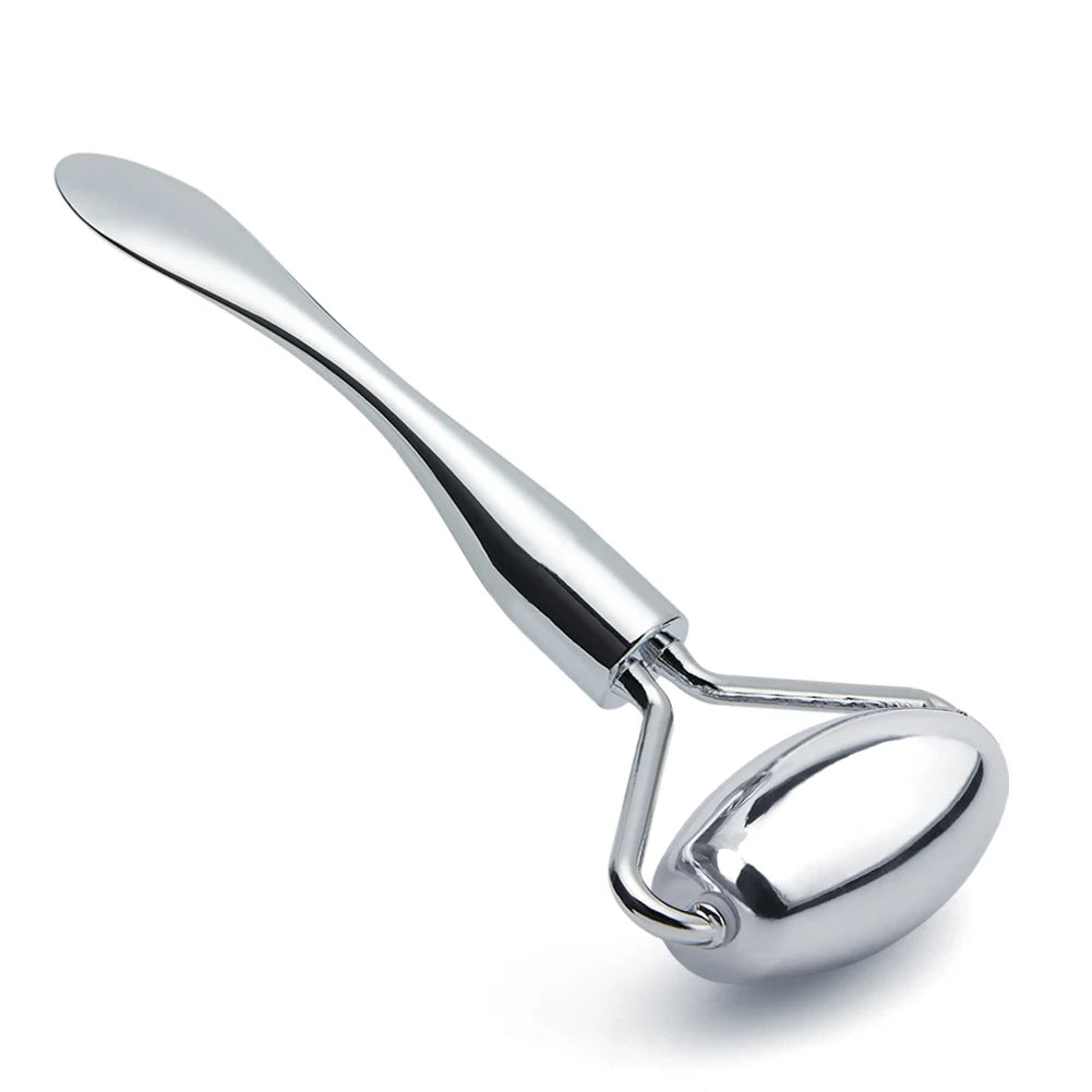 Silver zinc alloy facial roller massager with a flat spatula-style handle, isolated on a white background.