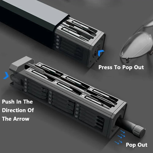 Precision screwdriver bit holder with included driver shaft, shown with bits popped out