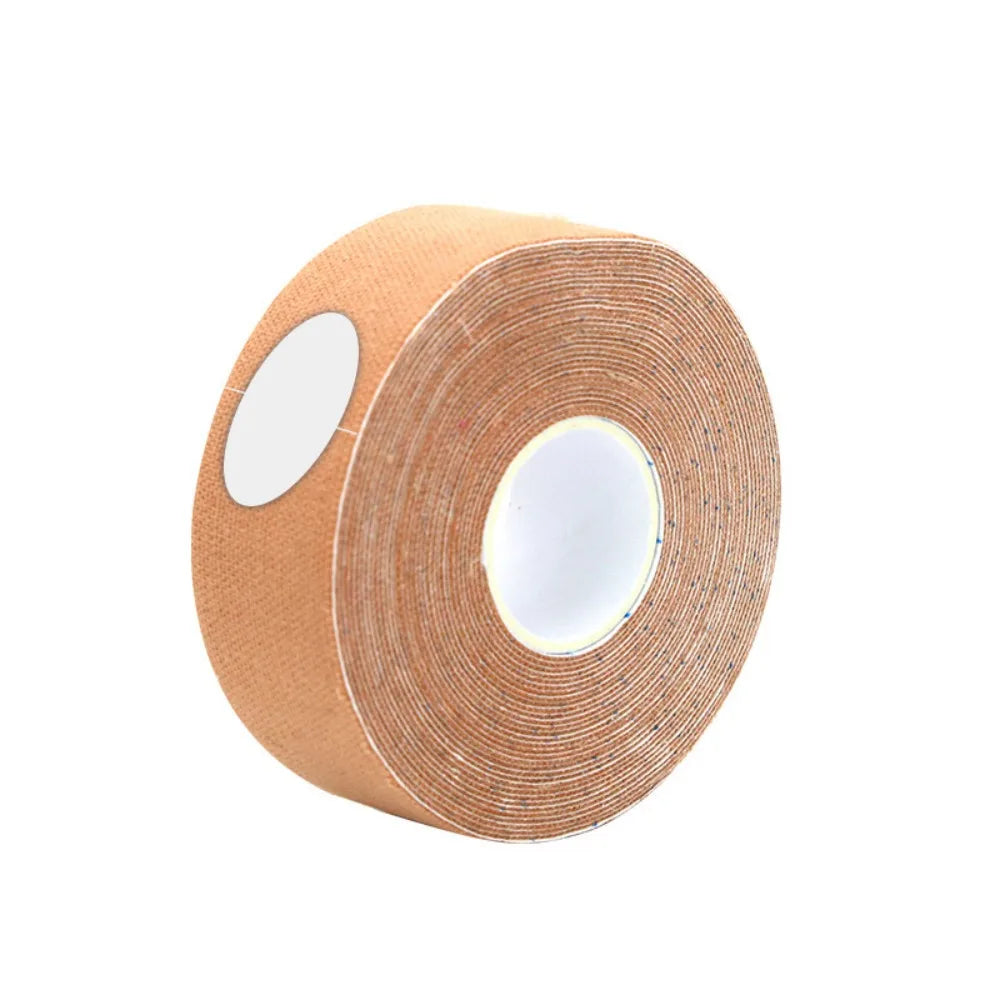 A roll of beige, fabric-textured face-lifting tape on a white plastic core, angled against a plain white background.
