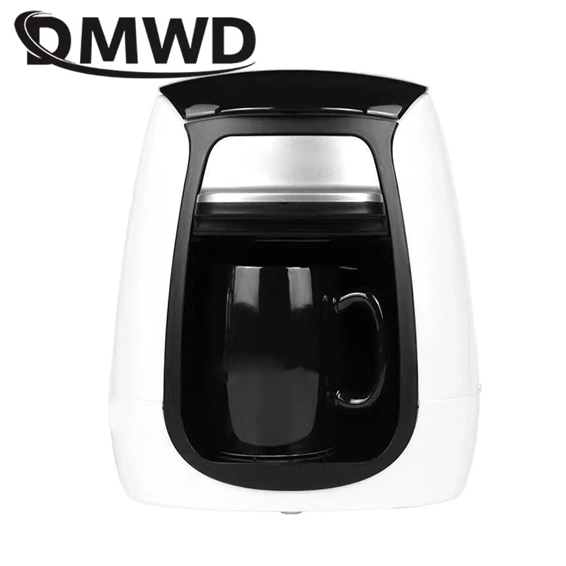 QMWD single-serve coffee maker in white and black plastic, compact drip machine with included black mug.