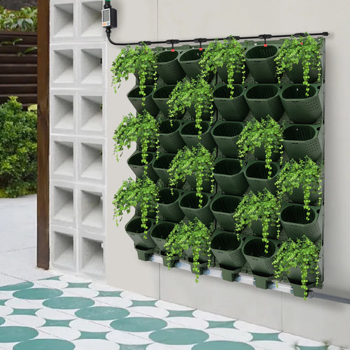 Green vertical wall planter with cascading cups and trailing greenery for wall gardening