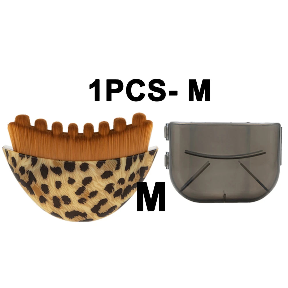 Leopard-print face massager brush with brown bristles and a matching translucent protective cover.