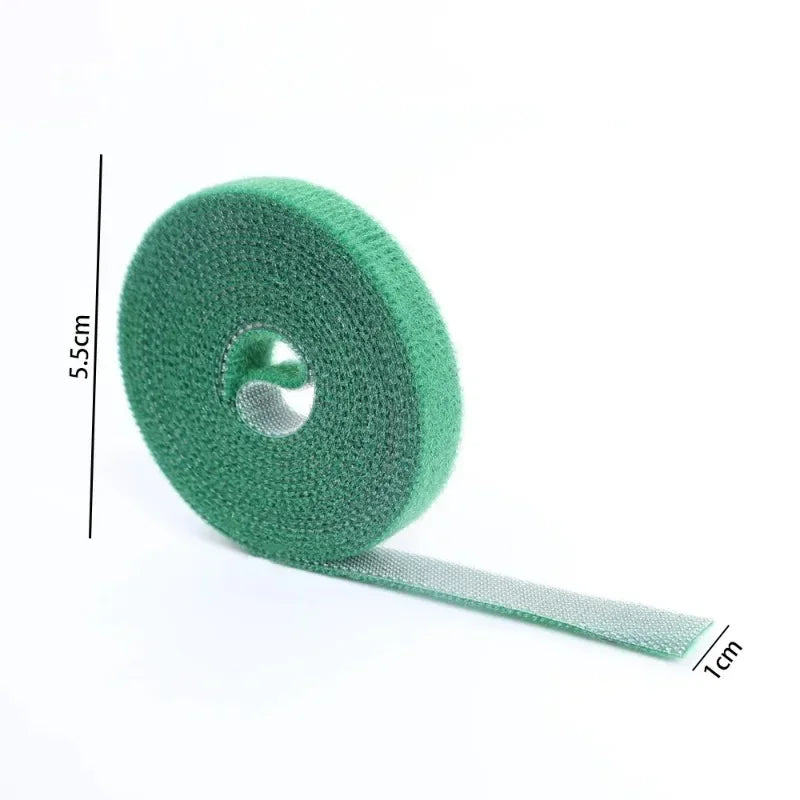 Green hook-and-loop tape roll with size marks: 5.5 cm wide, 1 cm label.