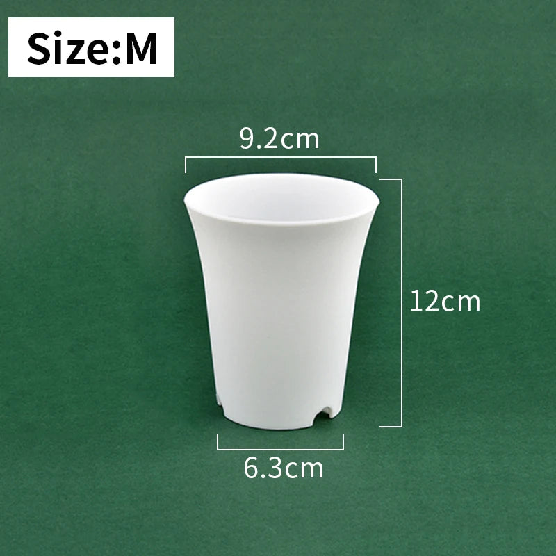 Medium white plastic nursery seedling pot, tapered sides and drainage holes