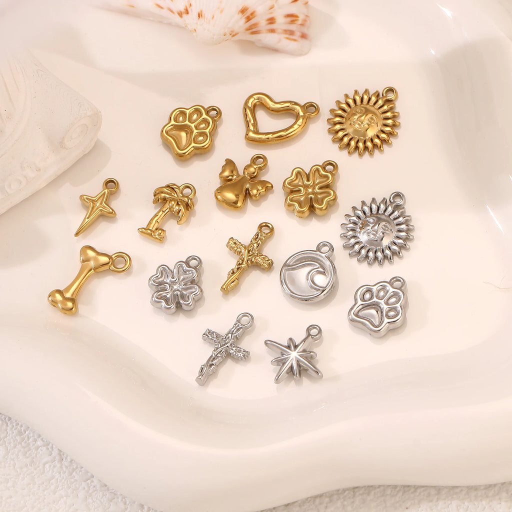 Gold and silver stainless steel pet paw, bone, and star charms for DIY pet jewelry making and custom pet accessories.