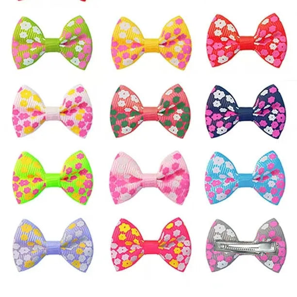 Colorful floral bow hair clips for small dogs and cats, perfect for pet grooming and cute styling accessories.