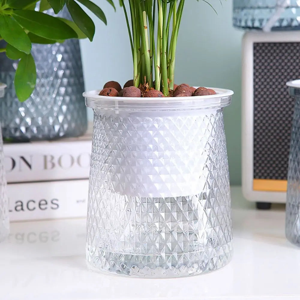 Self-watering white plastic plant pot with clear top reservoir and visible water-level window
