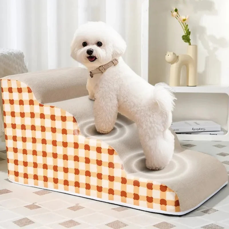 White dog on a plaid memory foam pet staircase. Stable, anti-slip steps to help small dogs climb onto the sofa.