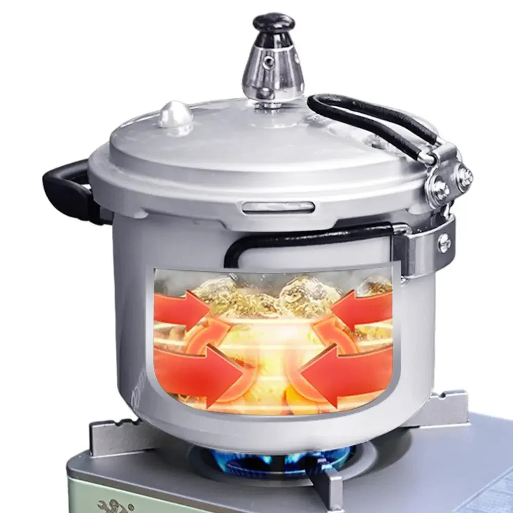 Portable pressure cooker with clear window showing heating inside and black top handle