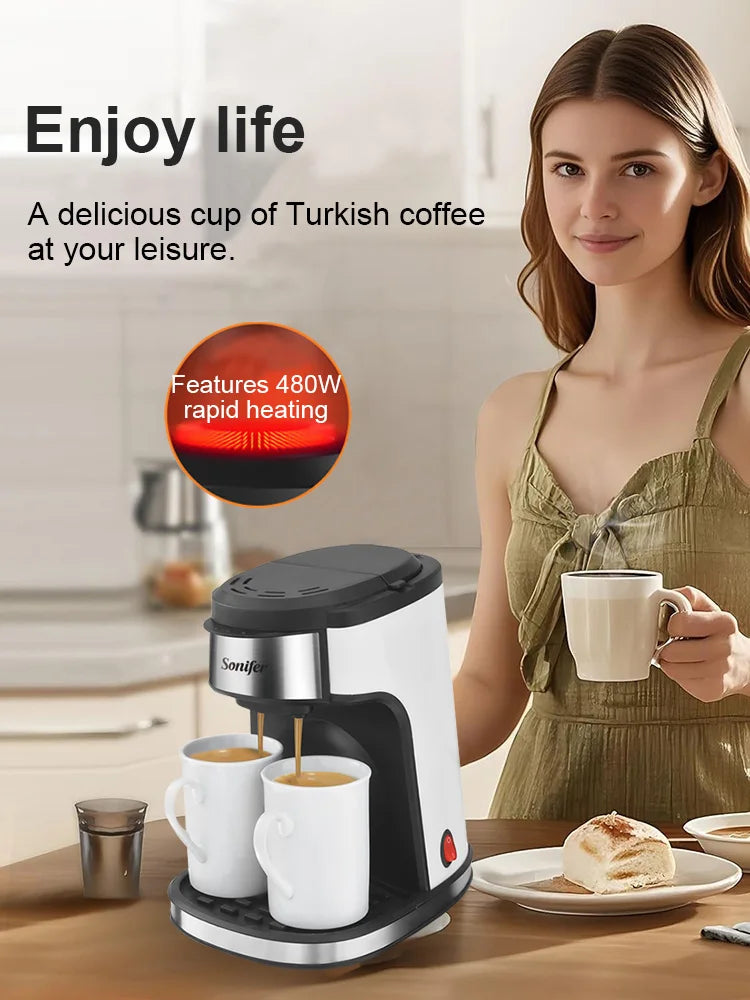 Sonifer 480W rapid heating Turkish coffee maker, compact white and black design, brewing into two white cups.