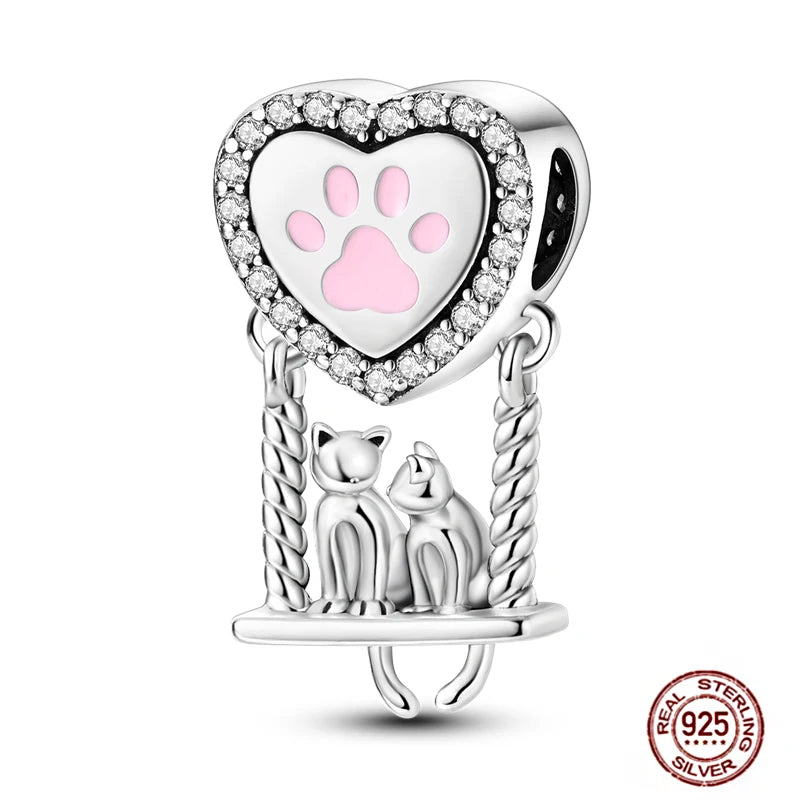 925 Sterling Silver cat charm with heart paw print and cubic zirconia, fits DIY bracelets for pet lovers.