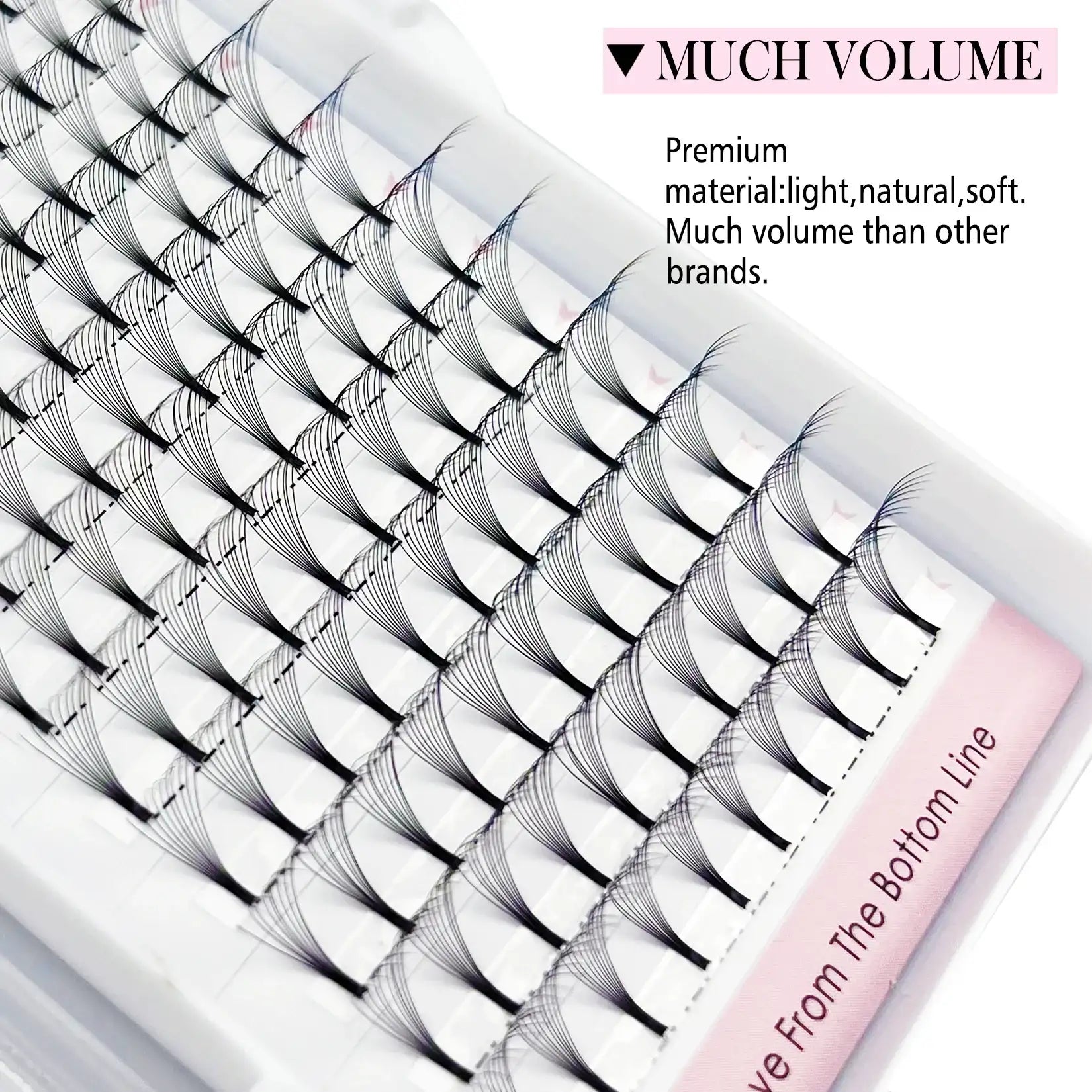 Tray of black short-stem premade Russian volume lash fans arranged in neat rows on a white palette.
