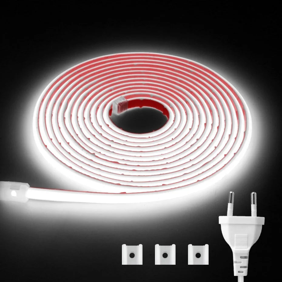 White COB LED strip light coiled with EU/AU plug and three adapter pins.