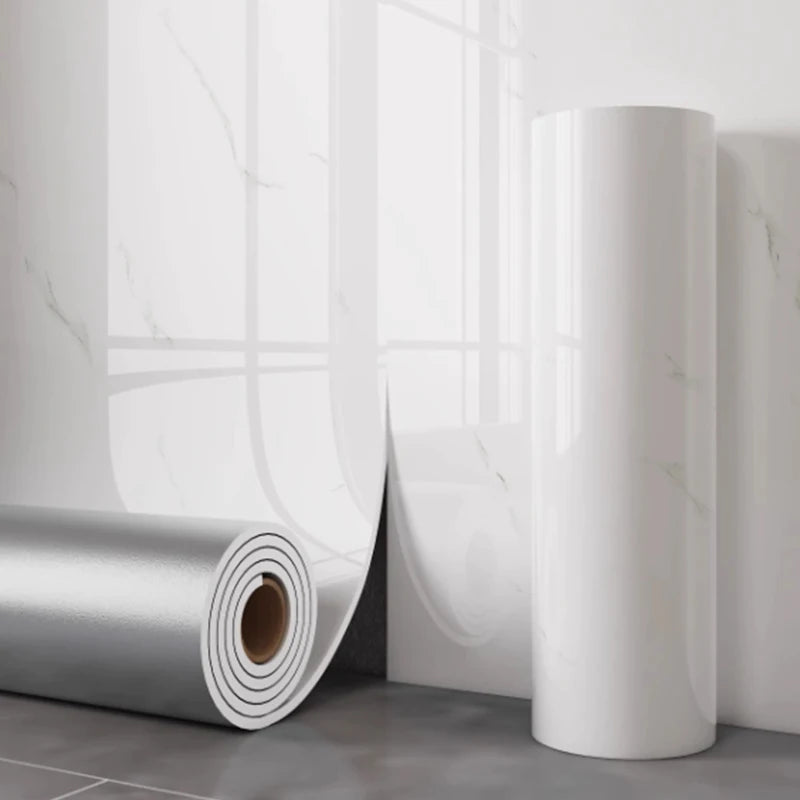 White marble-effect self-adhesive wallpaper roll with curled edge and background tiles