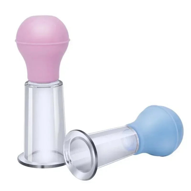 Two facial massage cupping tools with clear cylindrical bases and soft pink and blue rubber suction bulbs.