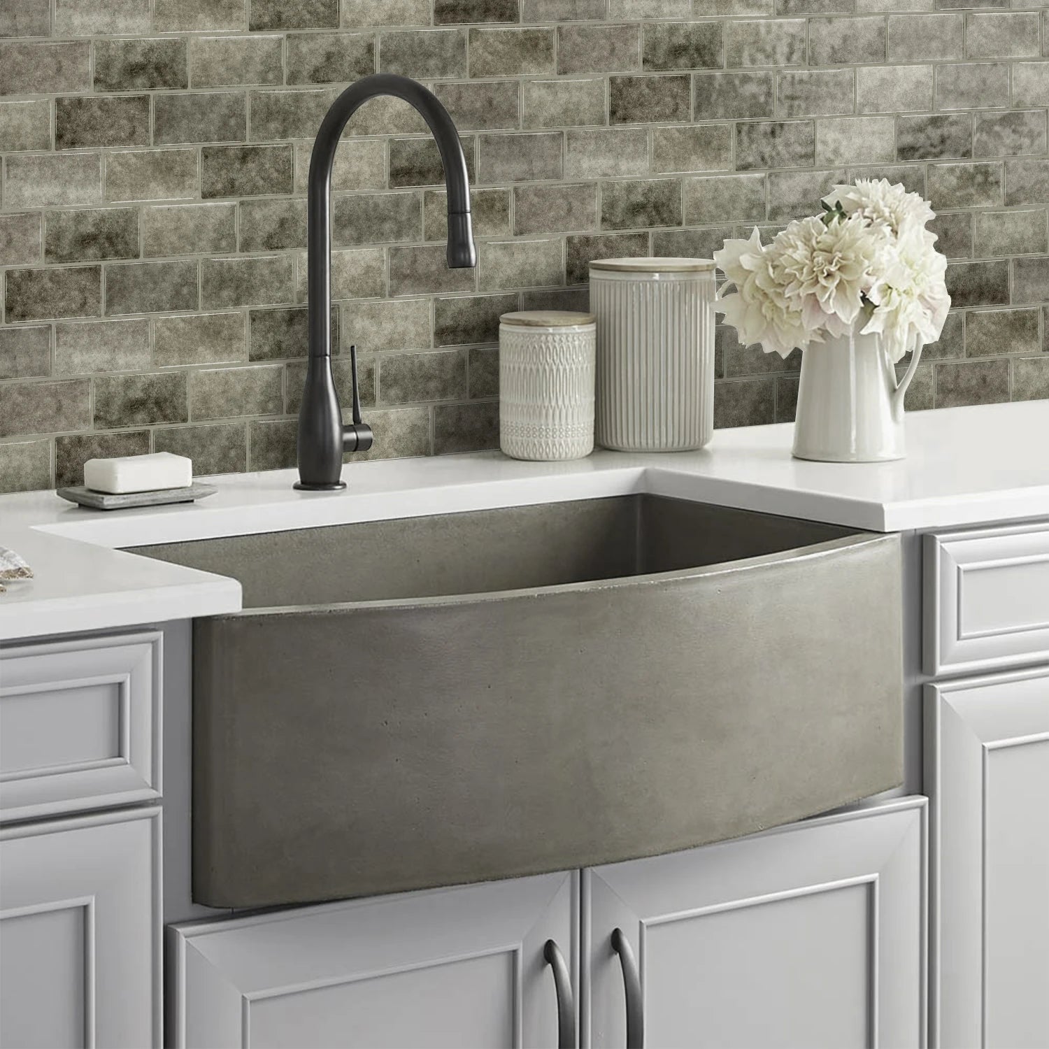 Ceramic tile sticker strip in dark gray stone texture on kitchen backsplash wall