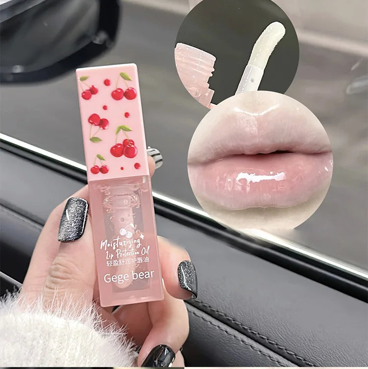 Gege Bear cherry lip oil for hydrated, glossy lips. Clear, moisturizing texture with cute cherry print packaging.