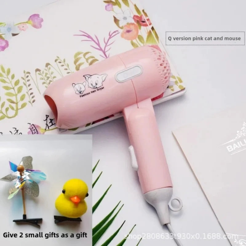 Pink folding mini hair dryer with cat and mouse design, 400W low-power travel tool, includes two cute small gifts.