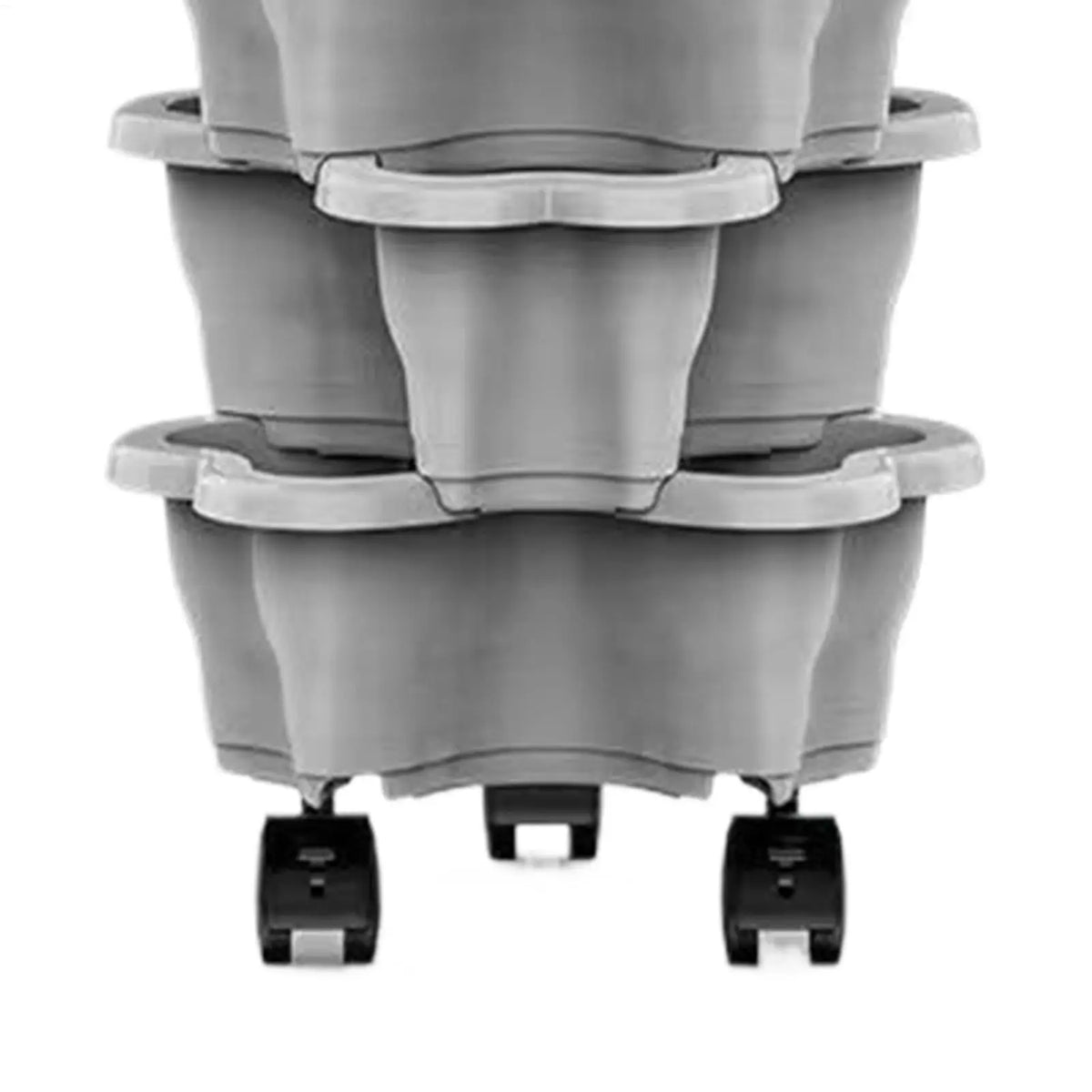 Lower section of a gray plastic vertical planter tower showing rolling wheels and tier bases