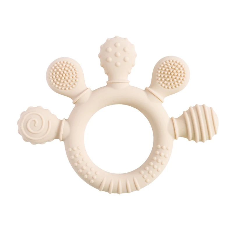 Beige silicone baby teething ring toy for infant gum relief.