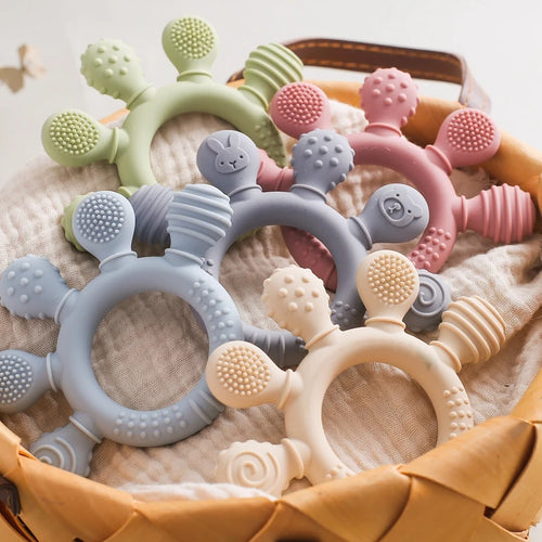 Multi-colored silicone baby teething rings for soothing relief. Textured safe material for infant teething support.