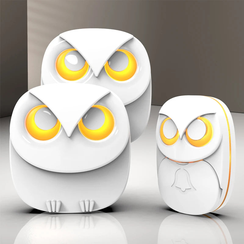 Wireless doorbell chime set with three white owl-style chime units, glowing yellow eyes