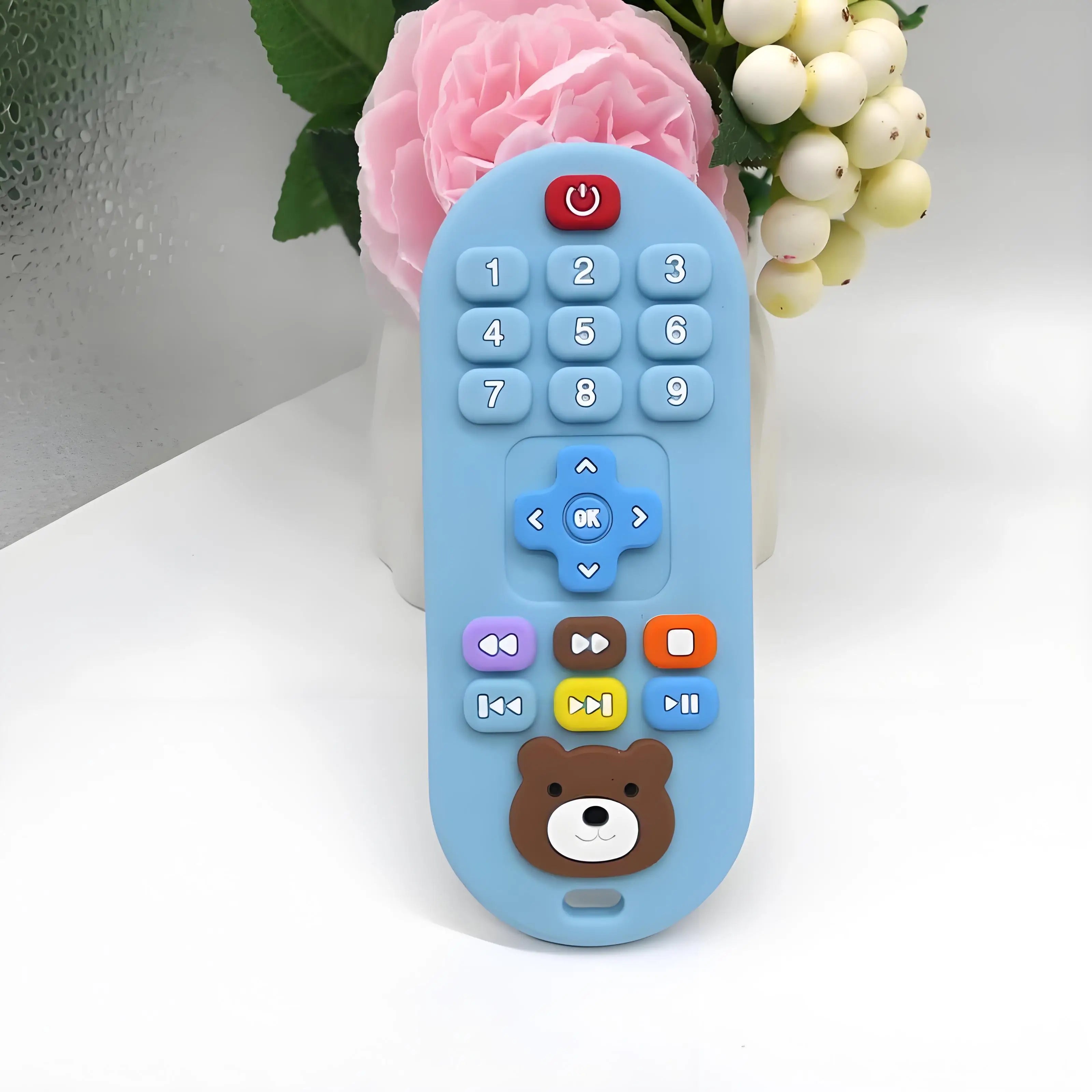 Blue silicone remote control baby teething toy for soothing sore gums.