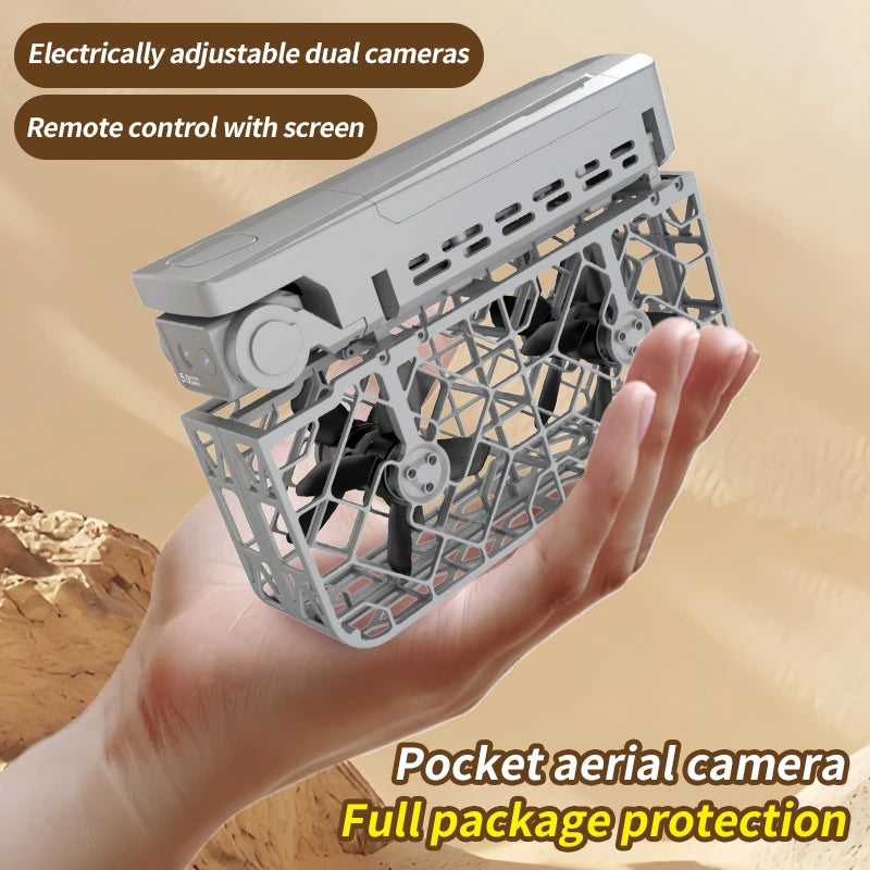 Grey pocket-sized drone with protective propeller guards and dual cameras, held in a hand for aerial photography.