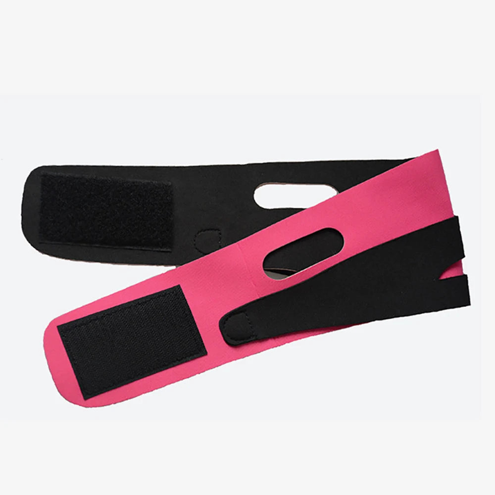 Pink and black neoprene V-line facial slimming strap with ear cutouts and adjustable velcro fastening.