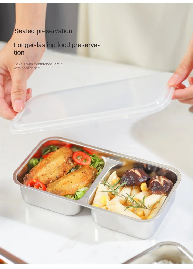 Electric lunch heating box with open stainless trays holding prepared meals