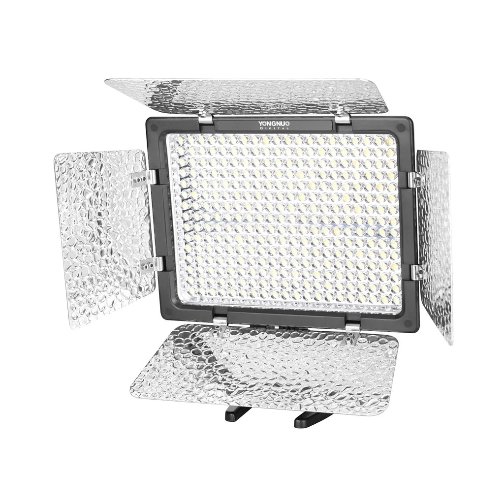 Rectangular LED video light with four adjustable, silver textured metal barn doors for shaping studio lighting.