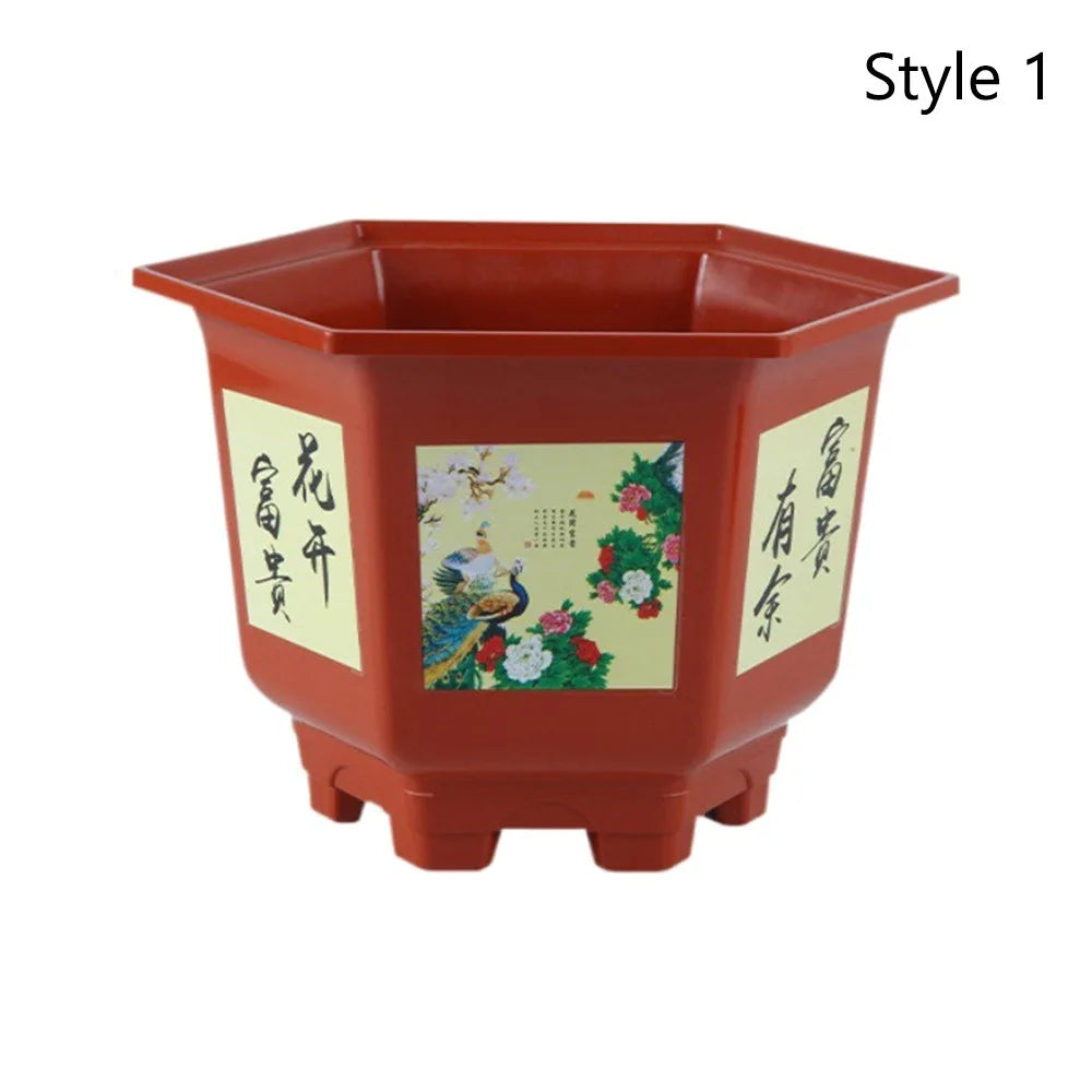 Red plastic planter with blue bird-and-flowers illustration on the front