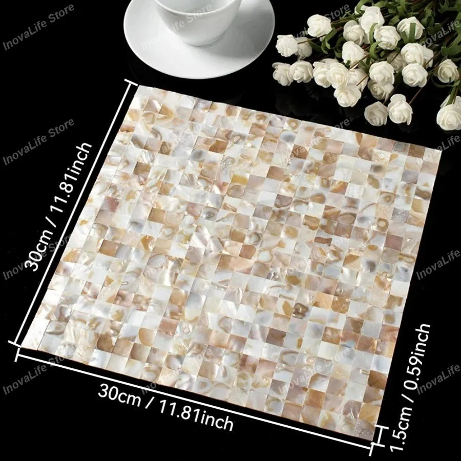 Cream and gold-toned mother-of-pearl mosaic tile sheet with reflective square chips