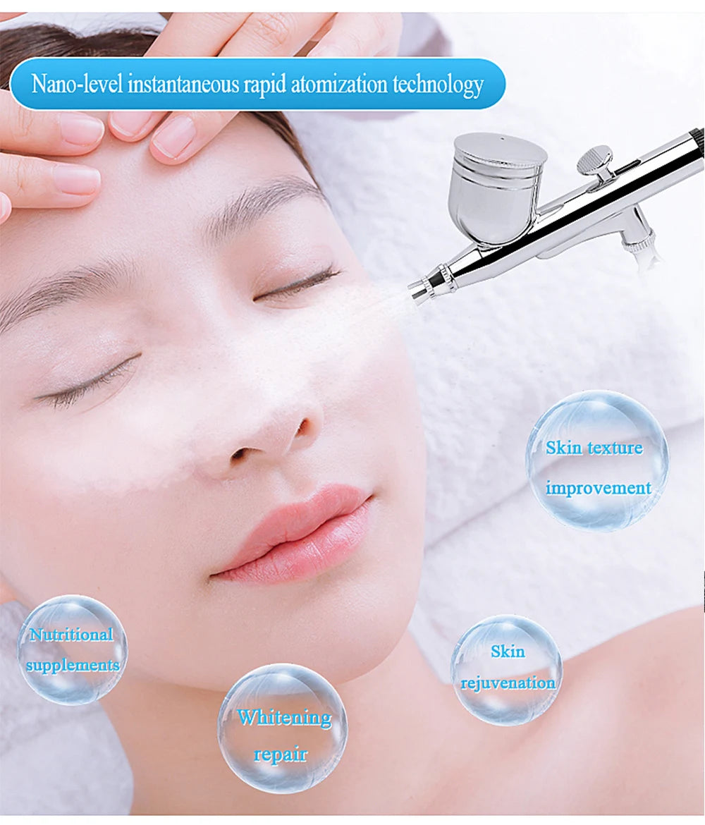 Silver metal facial airbrush spraying fine mist onto a person's face with floating text bubbles about skin benefits.