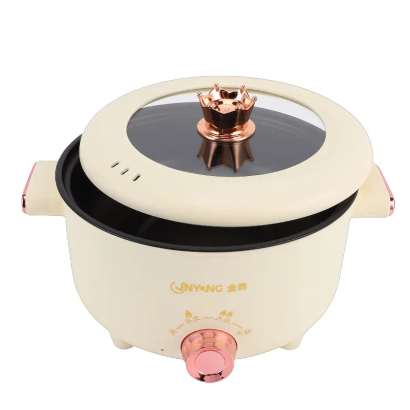Cream electric cooker with lid removed showing black inner heating surface and copper burner top
