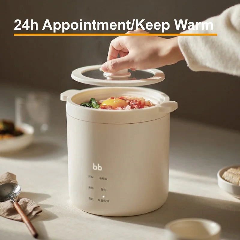 White electric rice cooker lid open with food inside, touch top handle