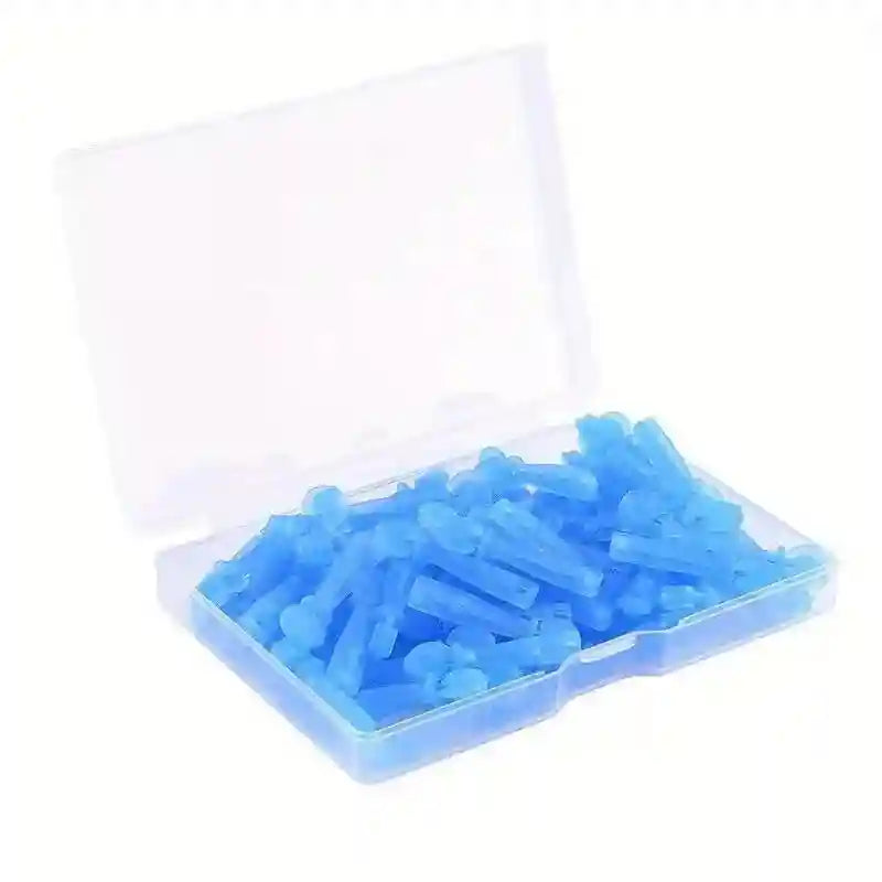 A clear plastic storage case filled with numerous small, blue disposable plastic acne lancets.