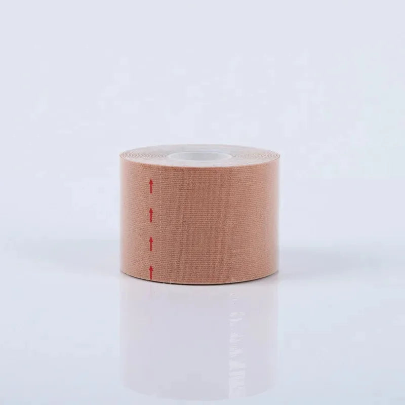 A roll of beige, fabric-textured face lifting tape featuring small, vertically aligned red arrows on the side.