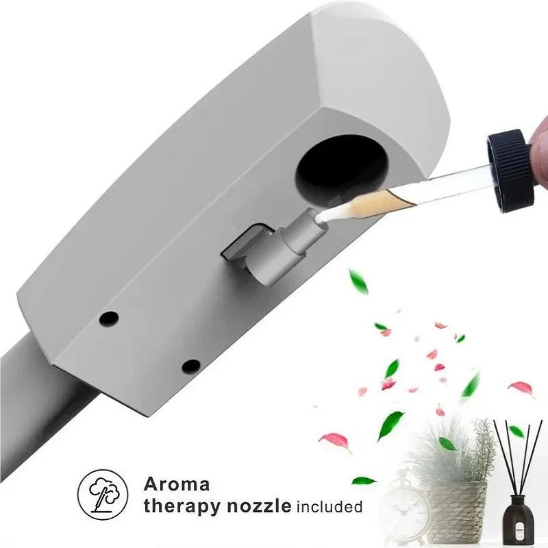 White professional ozone facial steamer head with aromatherapy nozzle being used for home spa skin treatment.