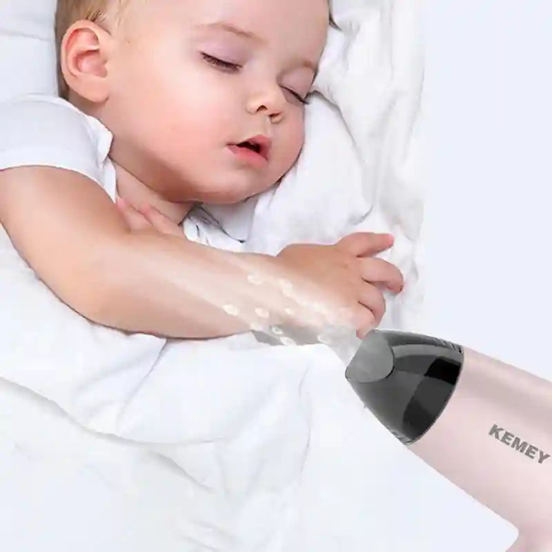 Kemei pink foldable portable hair dryer with concentrator nozzle, ultra-quiet 950W design perfect for travel or home.