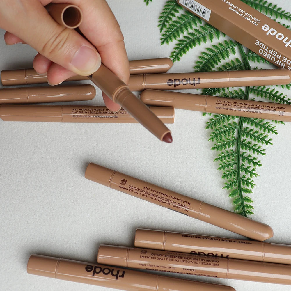 Rhode Peptide Lip Shape pencil in a neutral brown shade, a long-lasting matte lip liner for precise lip definition.