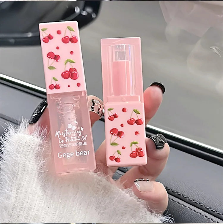 Gege Bear cherry lip oil and moisturizing balm set in pink packaging with cute cherry print for tender, hydrated lips.
