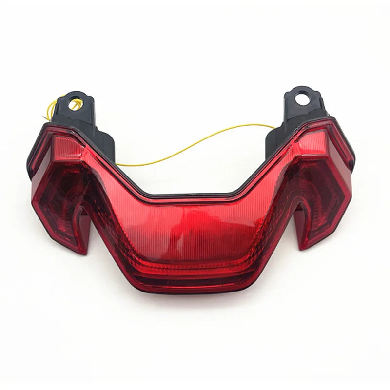 Red integrated rear tail light with black side housings and mounting holes