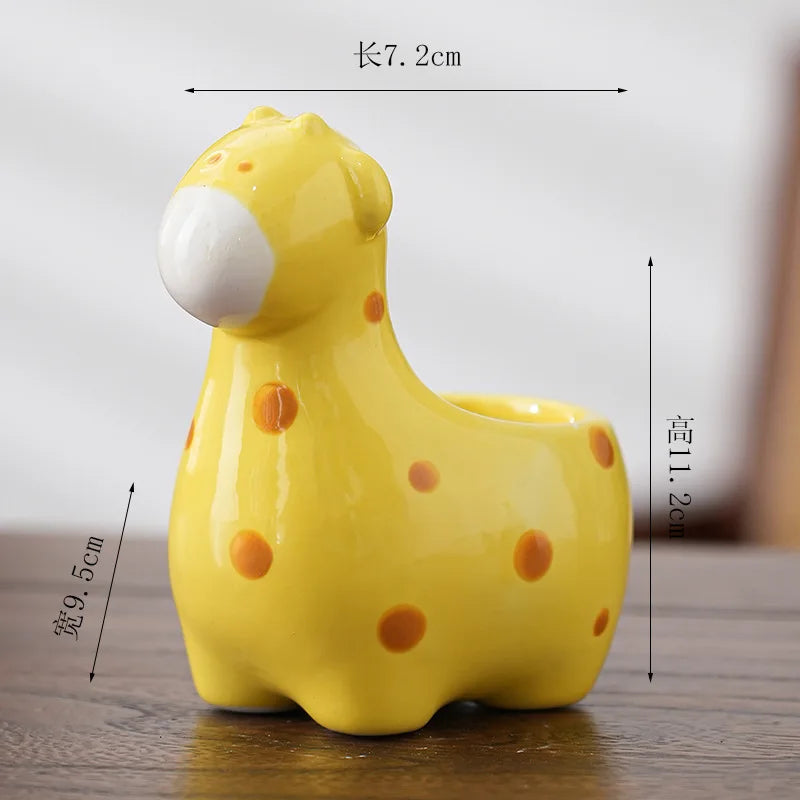 Yellow animal-shaped ceramic flower pot with white muzzle and orange polka dots